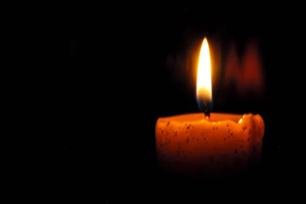 depositphotos_378560670-stock-photo-one-light-candle-burning-brightly